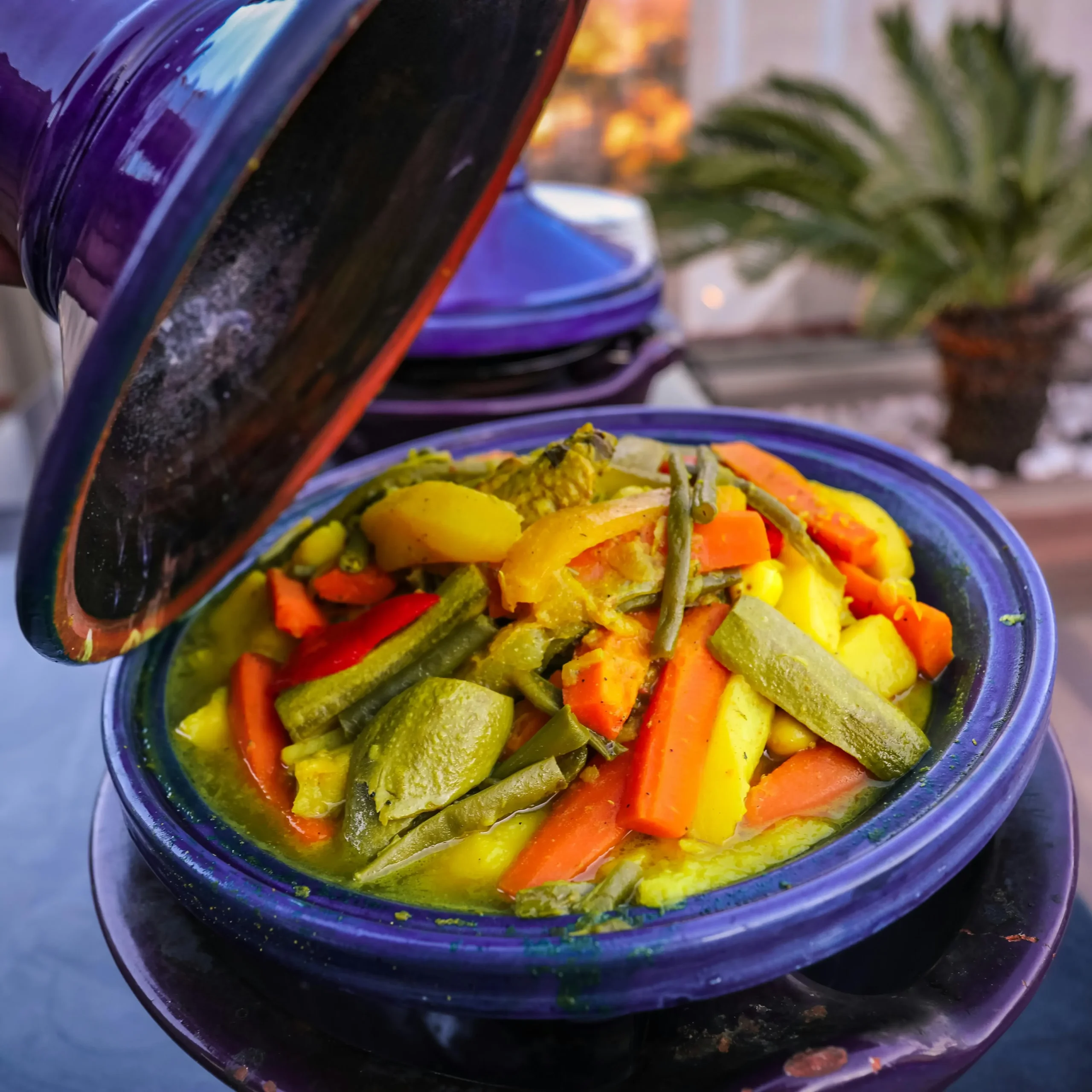 A vegetable tajine in a blue tajine pot