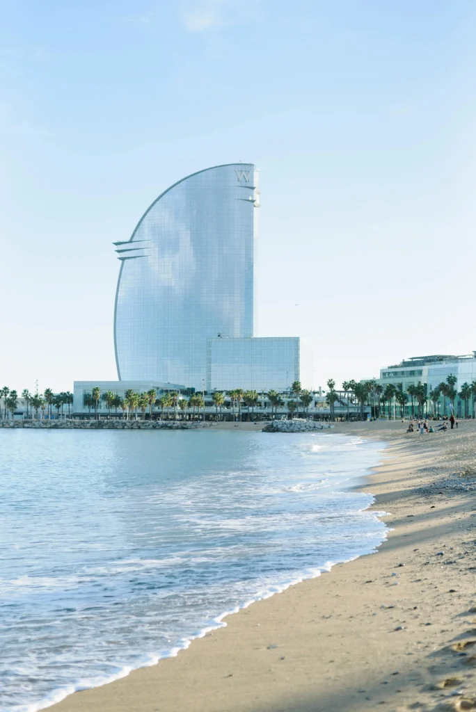 View of Barceloneta Beach with the W Barcelona Hotel on the Mediterranean coast
