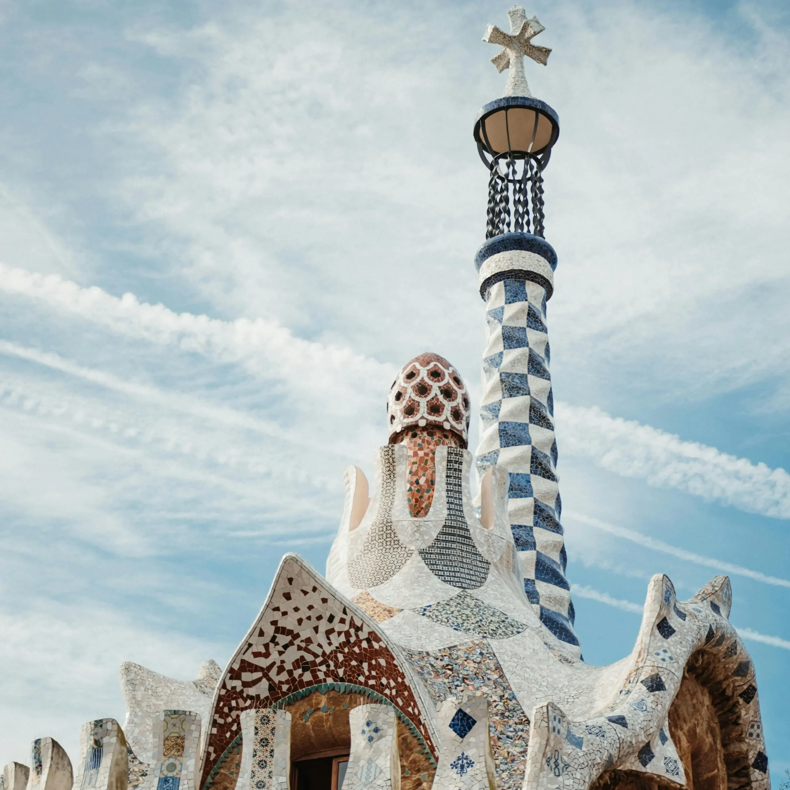 Decorative mosaic-covered rooftop and tower in Park Güell, Barcelona, designed by Antoni Gaudí.