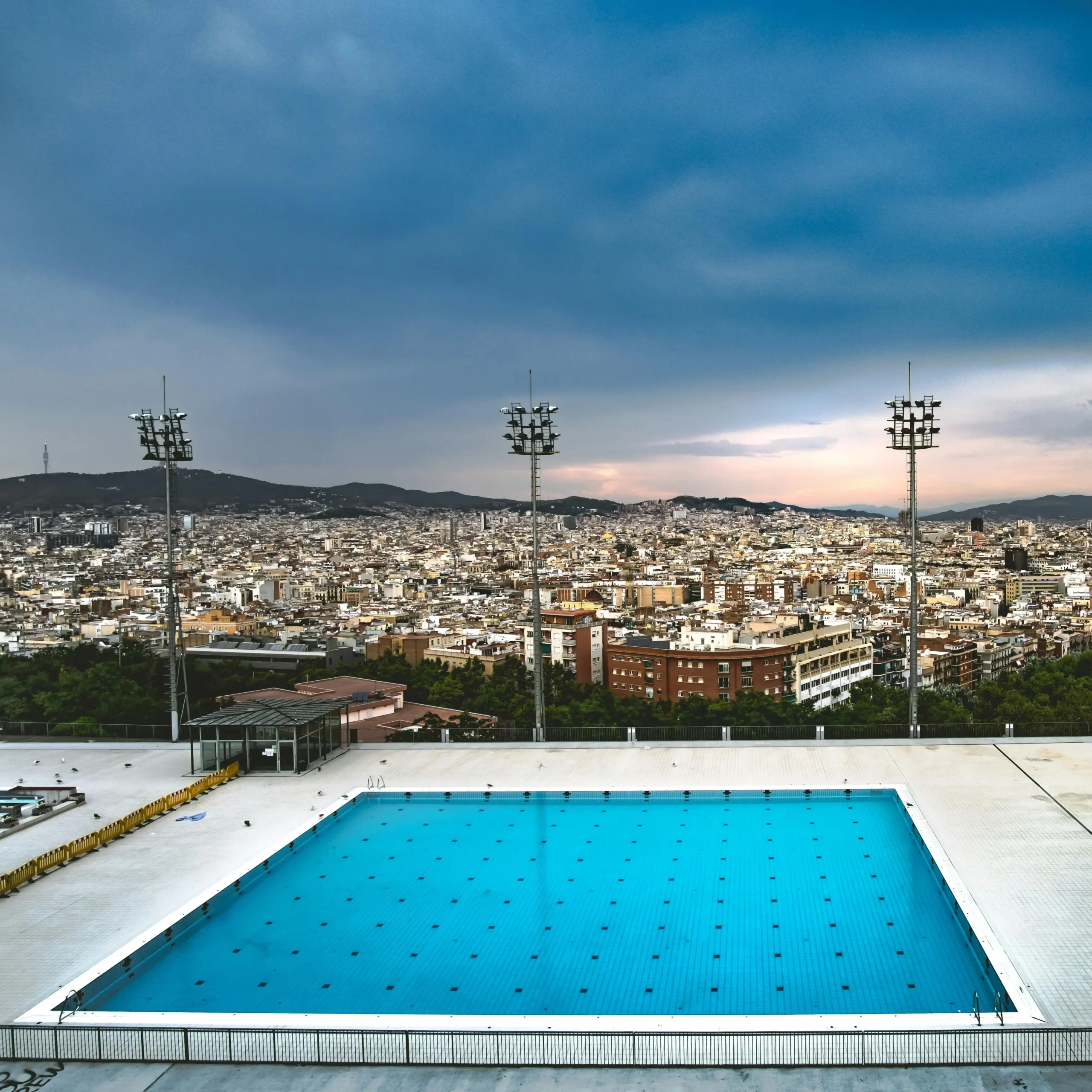 a view of montjuic pool looking over the city of Barcelona