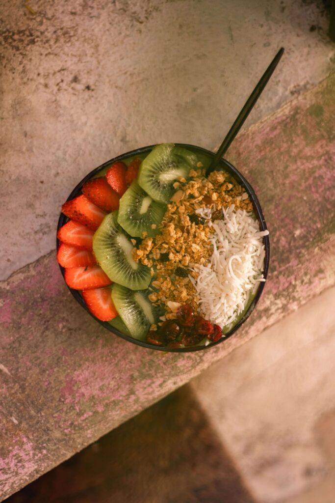 açai bowl with different kinds of fruit 

