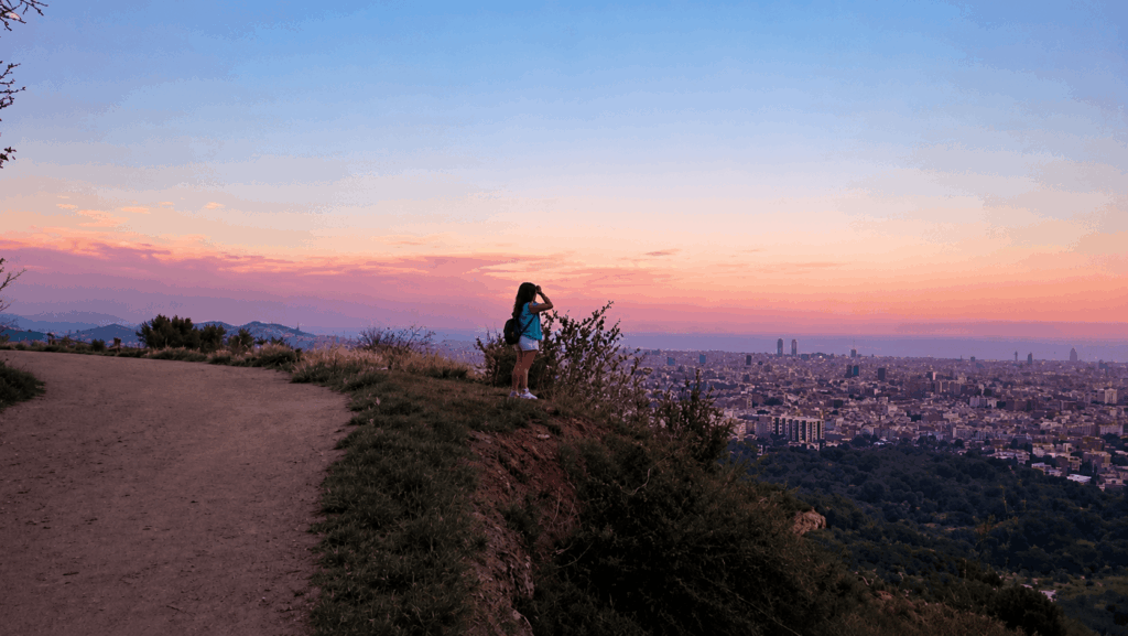 Path overlooking the city of Barcelona at sunset.