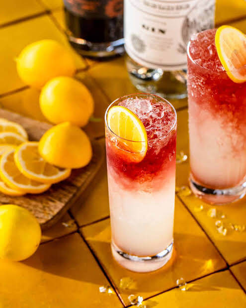 two cocktails with lemons