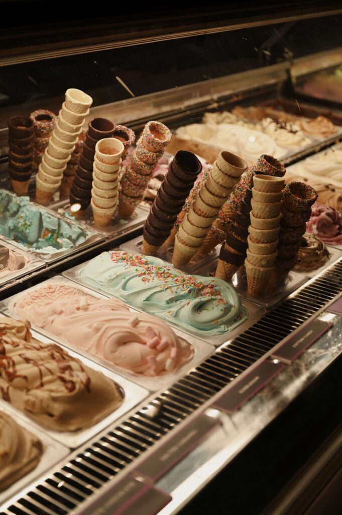 Ice cream cones and a selection of colourful flavours 