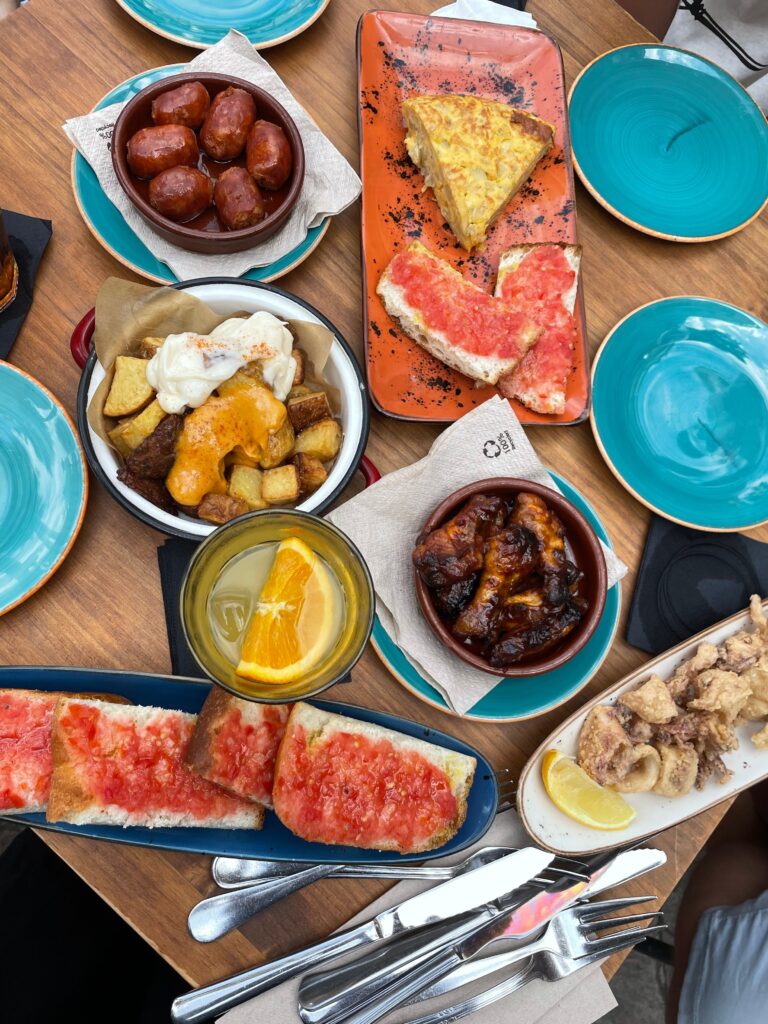A selection of tapas laid out on a restaurant table 