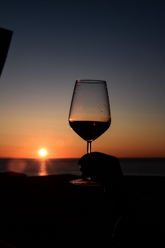 red wine glass at sunset 
