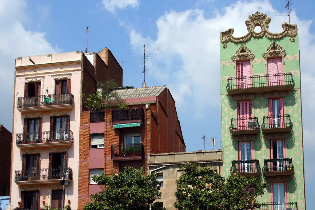 Colourful Barcelona buildings featuring ornate façades, decorative details and traditional wrought-iron balconies.