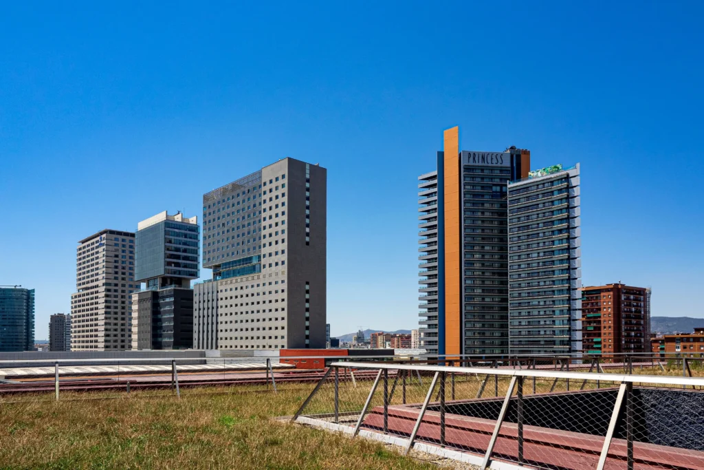 Modern high-rise buildings and contemporary architecture in Diagonal Mar, Barcelona, showcasing the neighbourhood's modern skyline near the Mediterranean coast.