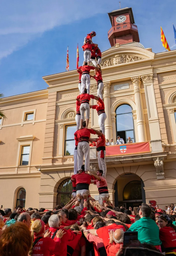 Castellers building a traditional Catalan human tower during a cultural celebration in Barcelona.