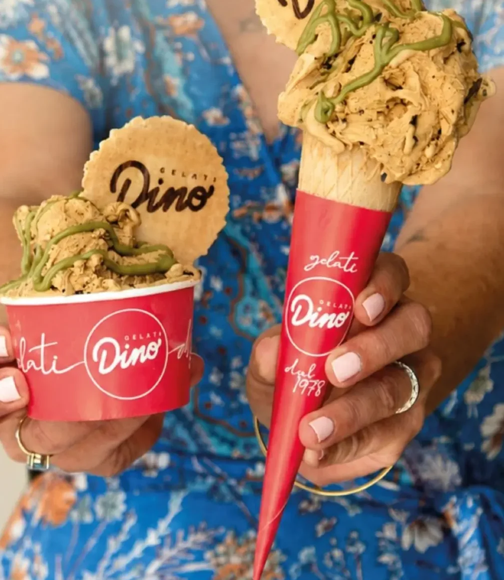 Cup and cone of artisan ice cream from Gelati Dino in Barcelona.