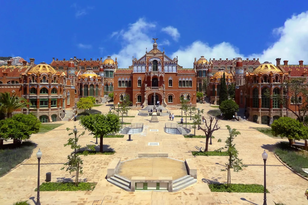 Main Modernist building and gardens of the historic Hospital de Sant Pau complex in Barcelona.