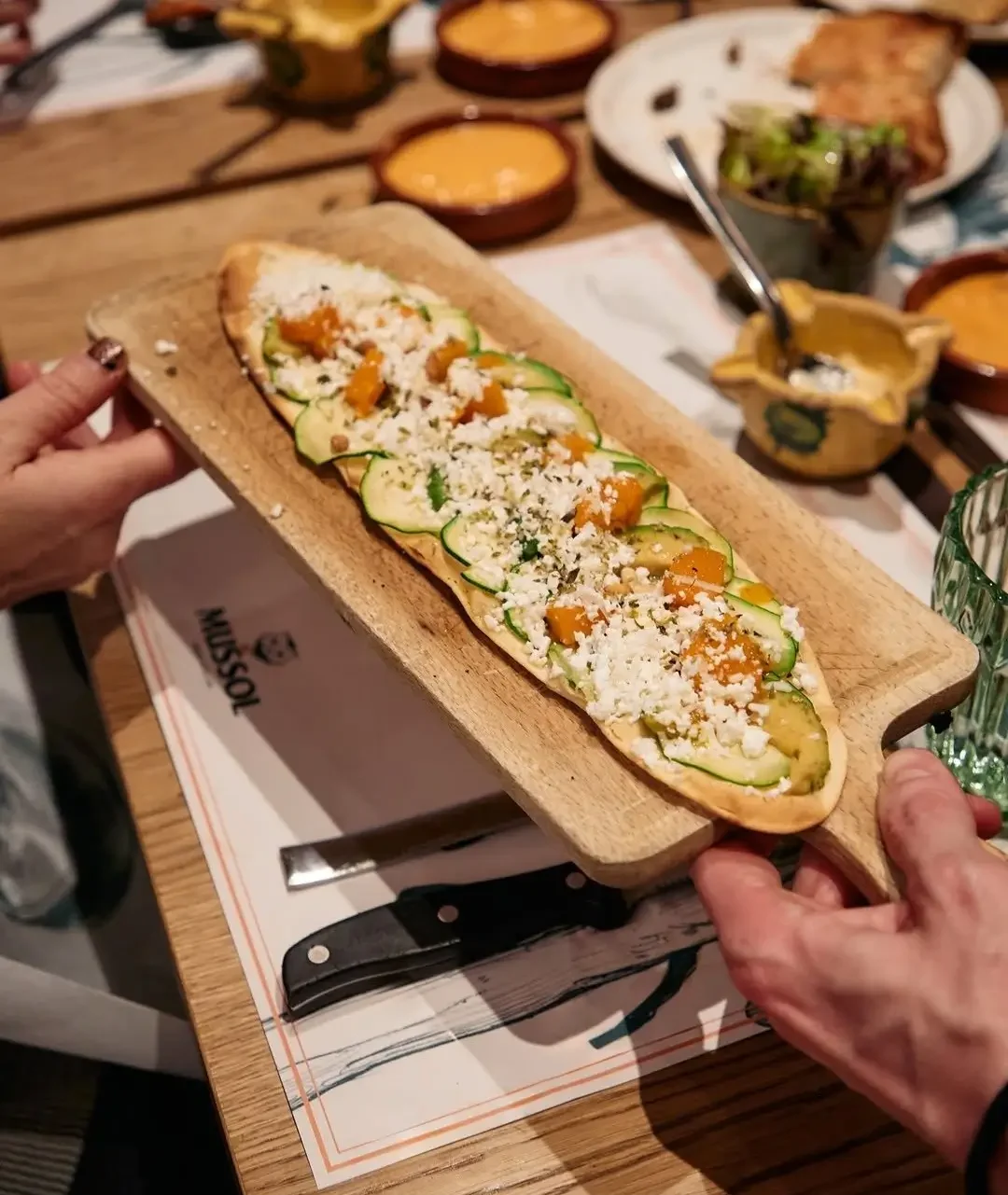 Catalan-style flatbread with courgette, cheese and vegetables served at Mussol restaurant in Barcelona.